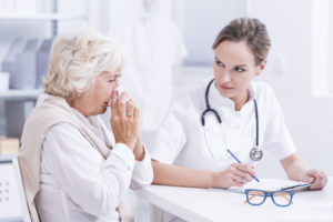 doctor speaking with eldery woman